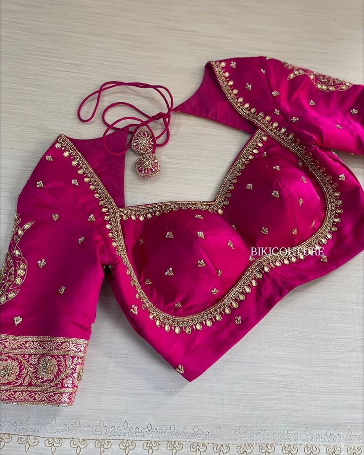 Bridal blouse design in pink with embroidered borders