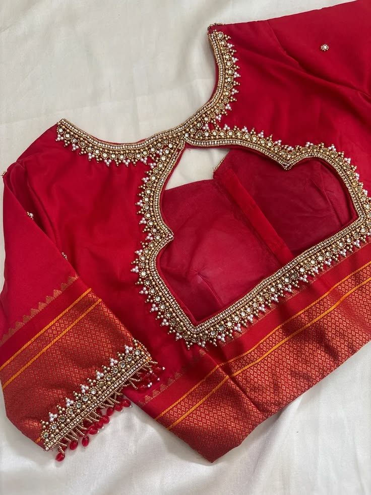 Bridal blouse design in red with embellished neckline
