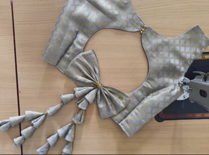 Festive wear blouse design with bow-tie back pattern