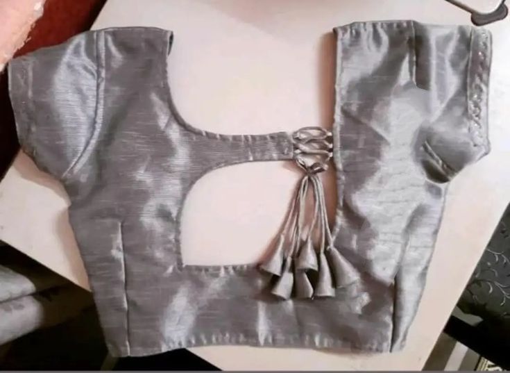 Party wear blouse design in grey with tie and tassels