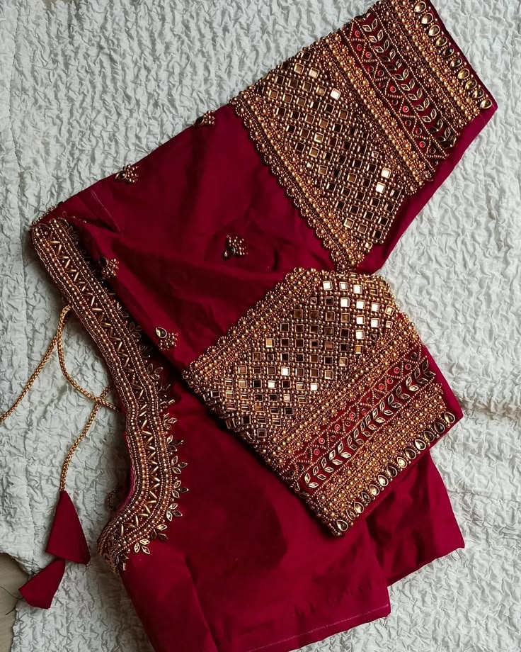 Maroon silk bridal blouse with mirror work, gold beads and scalloped neckline