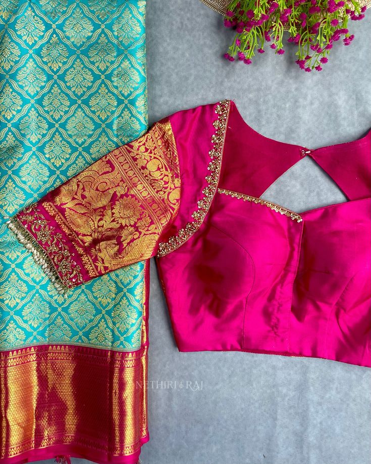 Turquoise silk bridal saree with gold zari, magenta hand-embroidered blouse and diamond back cutout