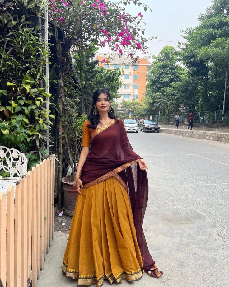 Designer mustard yellow and maroon half saree langa voni with gold border pleated skirt and matching blouse — ladies tailor Chennai